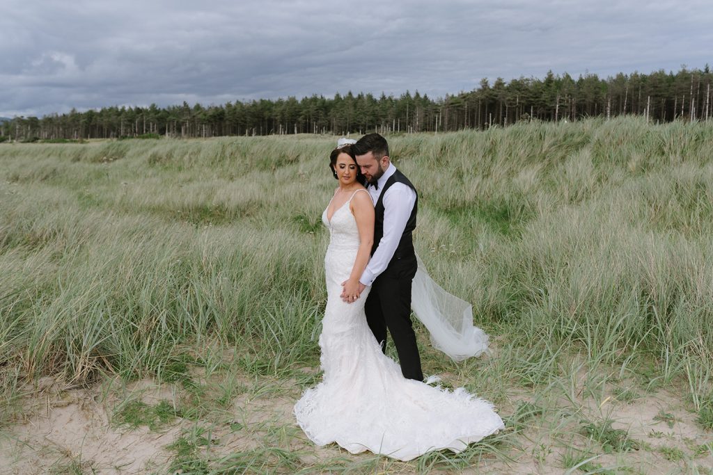 bride and groom on beach donegal