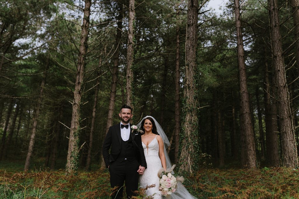 bride and groom in woods donegal